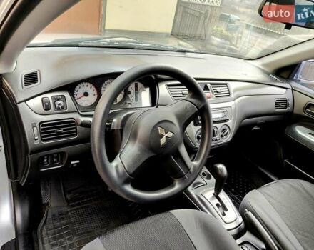 Серый Мицубиси Лансер, объемом двигателя 1.58 л и пробегом 185 тыс. км за 4700 $, фото 8 на Automoto.ua