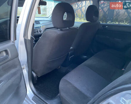 Серый Мицубиси Лансер, объемом двигателя 1.6 л и пробегом 203 тыс. км за 5200 $, фото 7 на Automoto.ua