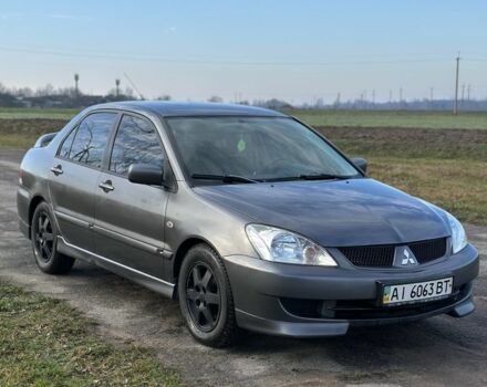 Серый Мицубиси Лансер, объемом двигателя 1.6 л и пробегом 114 тыс. км за 4000 $, фото 2 на Automoto.ua