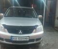 Сірий Міцубісі Lancer, об'ємом двигуна 1.58 л та пробігом 250 тис. км за 4500 $, фото 1 на Automoto.ua