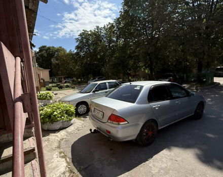 Сірий Міцубісі Lancer, об'ємом двигуна 1.6 л та пробігом 255 тис. км за 4100 $, фото 1 на Automoto.ua