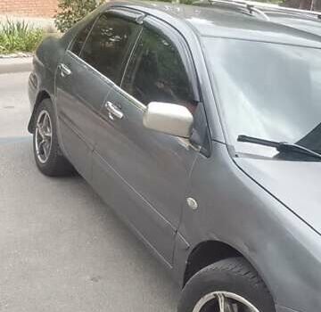 Сірий Міцубісі Lancer, об'ємом двигуна 1.58 л та пробігом 323 тис. км за 3300 $, фото 7 на Automoto.ua