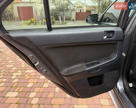 Сірий Міцубісі Lancer, об'ємом двигуна 2 л та пробігом 92 тис. км за 8200 $, фото 26 на Automoto.ua