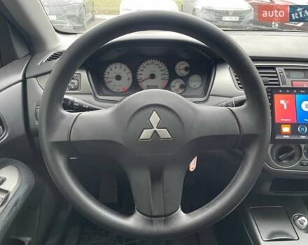 Серый Мицубиси Лансер, объемом двигателя 1.58 л и пробегом 146 тыс. км за 5490 $, фото 14 на Automoto.ua