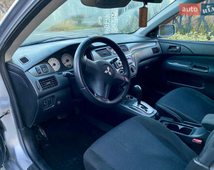 Серый Мицубиси Лансер, объемом двигателя 1.6 л и пробегом 203 тыс. км за 5200 $, фото 4 на Automoto.ua