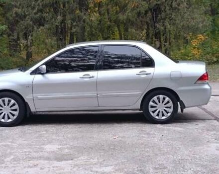 Сірий Міцубісі Lancer, об'ємом двигуна 1.6 л та пробігом 176 тис. км за 4999 $, фото 11 на Automoto.ua