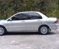 Сірий Міцубісі Lancer, об'ємом двигуна 1.6 л та пробігом 176 тис. км за 4999 $, фото 11 на Automoto.ua