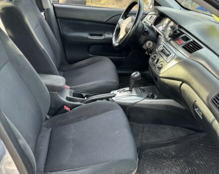 Серый Мицубиси Лансер, объемом двигателя 1.6 л и пробегом 228 тыс. км за 4500 $, фото 5 на Automoto.ua