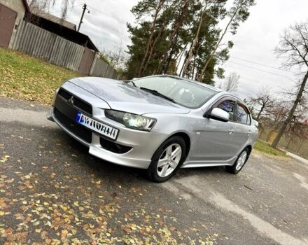 Серый Мицубиси Лансер, объемом двигателя 2 л и пробегом 225 тыс. км за 6890 $, фото 2 на Automoto.ua