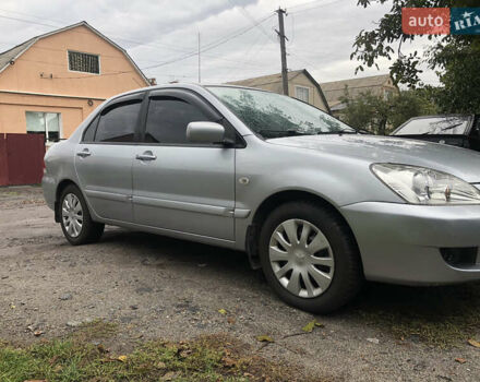 Сірий Міцубісі Lancer, об'ємом двигуна 1.58 л та пробігом 240 тис. км за 4299 $, фото 1 на Automoto.ua