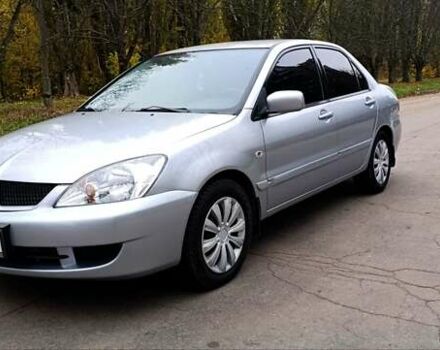 Серый Мицубиси Лансер, объемом двигателя 1.58 л и пробегом 176 тыс. км за 5000 $, фото 2 на Automoto.ua