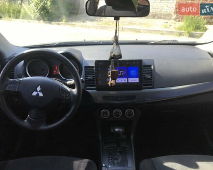 Серый Мицубиси Лансер, объемом двигателя 2 л и пробегом 256 тыс. км за 7000 $, фото 5 на Automoto.ua