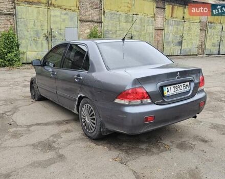 Сірий Міцубісі Lancer, об'ємом двигуна 1.58 л та пробігом 200 тис. км за 1700 $, фото 1 на Automoto.ua