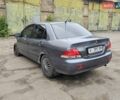 Сірий Міцубісі Lancer, об'ємом двигуна 1.58 л та пробігом 200 тис. км за 1700 $, фото 1 на Automoto.ua