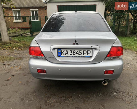 Сірий Міцубісі Lancer, об'ємом двигуна 1.58 л та пробігом 240 тис. км за 4299 $, фото 6 на Automoto.ua