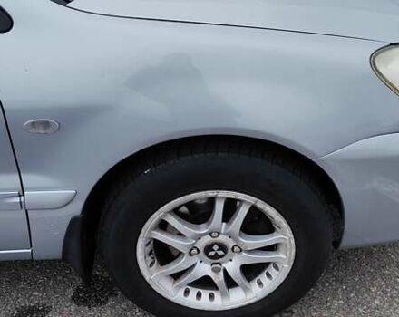 Серый Мицубиси Лансер, объемом двигателя 1.58 л и пробегом 216 тыс. км за 4700 $, фото 1 на Automoto.ua