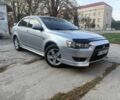 Серый Мицубиси Лансер, объемом двигателя 2 л и пробегом 220 тыс. км за 6001 $, фото 1 на Automoto.ua