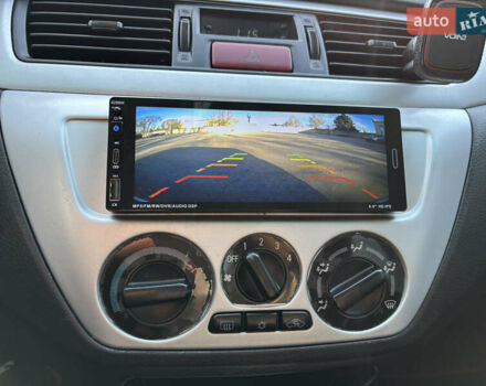 Серый Мицубиси Лансер, объемом двигателя 1.6 л и пробегом 193 тыс. км за 4000 $, фото 18 на Automoto.ua