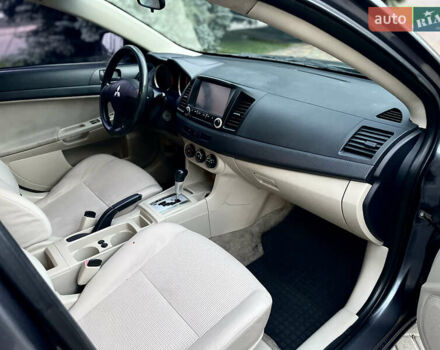 Серый Мицубиси Лансер, объемом двигателя 2 л и пробегом 212 тыс. км за 6000 $, фото 24 на Automoto.ua