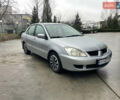 Сірий Міцубісі Lancer, об'ємом двигуна 1.58 л та пробігом 220 тис. км за 5900 $, фото 1 на Automoto.ua