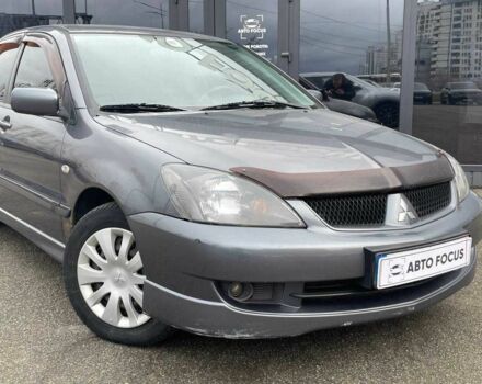 Серый Мицубиси Лансер, объемом двигателя 1.6 л и пробегом 146 тыс. км за 5990 $, фото 1 на Automoto.ua