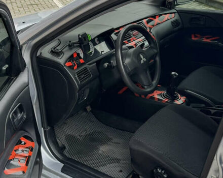 Сірий Міцубісі Lancer, об'ємом двигуна 1.6 л та пробігом 269 тис. км за 3999 $, фото 15 на Automoto.ua