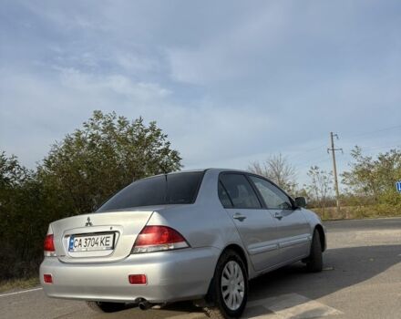 Серый Мицубиси Лансер, объемом двигателя 1.6 л и пробегом 228 тыс. км за 4500 $, фото 2 на Automoto.ua