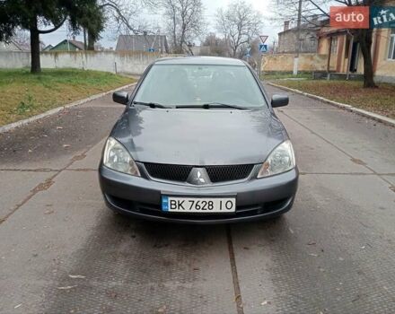 Серый Мицубиси Лансер, объемом двигателя 1.58 л и пробегом 205 тыс. км за 3300 $, фото 1 на Automoto.ua