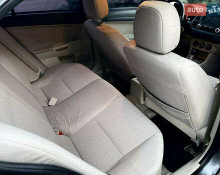 Серый Мицубиси Лансер, объемом двигателя 2 л и пробегом 212 тыс. км за 6000 $, фото 23 на Automoto.ua