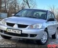 Серый Мицубиси Лансер, объемом двигателя 1.6 л и пробегом 20800 тыс. км за 3999 $, фото 1 на Automoto.ua