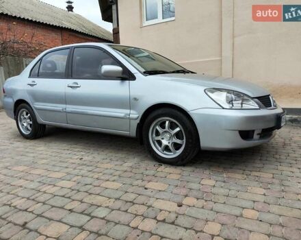 Серый Мицубиси Лансер, объемом двигателя 1.58 л и пробегом 185 тыс. км за 4700 $, фото 6 на Automoto.ua