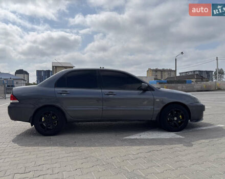 Серый Мицубиси Лансер, объемом двигателя 1.58 л и пробегом 250 тыс. км за 4300 $, фото 3 на Automoto.ua