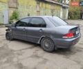 Серый Мицубиси Лансер, объемом двигателя 1.58 л и пробегом 200 тыс. км за 1700 $, фото 2 на Automoto.ua