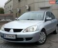Серый Мицубиси Лансер, объемом двигателя 1.6 л и пробегом 138 тыс. км за 5699 $, фото 1 на Automoto.ua