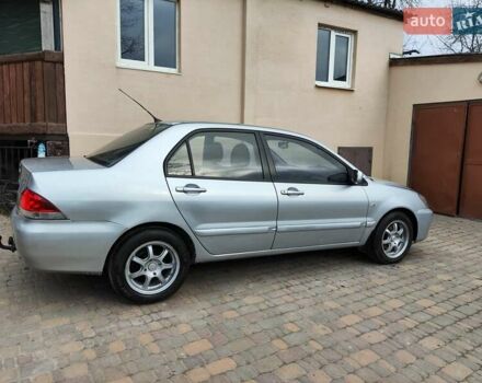 Серый Мицубиси Лансер, объемом двигателя 1.58 л и пробегом 185 тыс. км за 4700 $, фото 5 на Automoto.ua