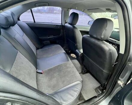 Серый Мицубиси Лансер, объемом двигателя 2 л и пробегом 203 тыс. км за 4999 $, фото 12 на Automoto.ua