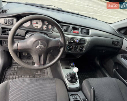 Серый Мицубиси Лансер, объемом двигателя 1.58 л и пробегом 250 тыс. км за 4300 $, фото 6 на Automoto.ua