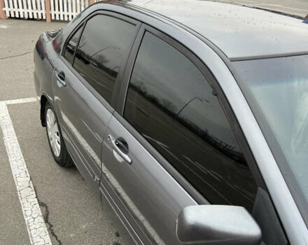 Серый Мицубиси Лансер, объемом двигателя 1.58 л и пробегом 183 тыс. км за 3800 $, фото 19 на Automoto.ua