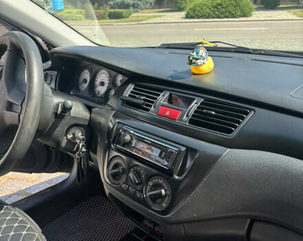 Серый Мицубиси Лансер, объемом двигателя 1.6 л и пробегом 222 тыс. км за 5200 $, фото 18 на Automoto.ua