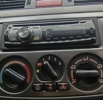 Серый Мицубиси Лансер, объемом двигателя 1.58 л и пробегом 176 тыс. км за 5000 $, фото 25 на Automoto.ua