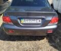 Серый Мицубиси Лансер, объемом двигателя 1.58 л и пробегом 667 тыс. км за 3000 $, фото 1 на Automoto.ua