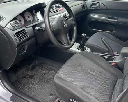 Сірий Міцубісі Lancer, об'ємом двигуна 1.59 л та пробігом 219 тис. км за 4500 $, фото 14 на Automoto.ua