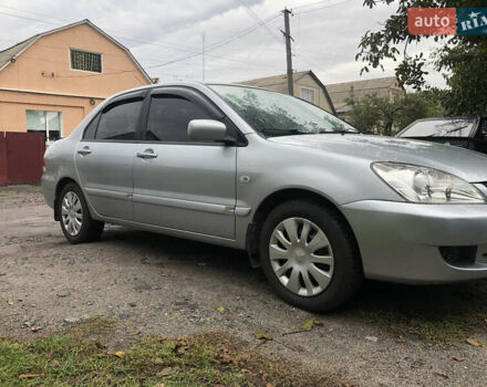 Сірий Міцубісі Lancer, об'ємом двигуна 1.58 л та пробігом 240 тис. км за 4299 $, фото 2 на Automoto.ua