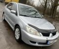 Серый Мицубиси Лансер, объемом двигателя 1.6 л и пробегом 229 тыс. км за 3900 $, фото 1 на Automoto.ua