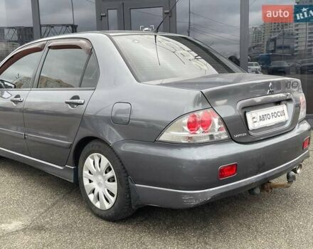 Серый Мицубиси Лансер, объемом двигателя 1.58 л и пробегом 146 тыс. км за 5490 $, фото 5 на Automoto.ua