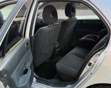 Серый Мицубиси Лансер, объемом двигателя 1.58 л и пробегом 145 тыс. км за 4800 $, фото 3 на Automoto.ua