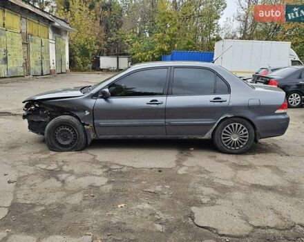 Сірий Міцубісі Lancer, об'ємом двигуна 1.58 л та пробігом 200 тис. км за 1700 $, фото 5 на Automoto.ua