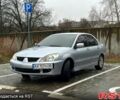 Сірий Міцубісі Lancer, об'ємом двигуна 1.6 л та пробігом 165 тис. км за 4000 $, фото 1 на Automoto.ua