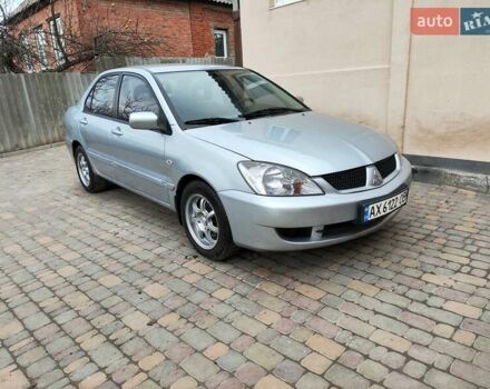 Серый Мицубиси Лансер, объемом двигателя 1.58 л и пробегом 185 тыс. км за 4700 $, фото 1 на Automoto.ua