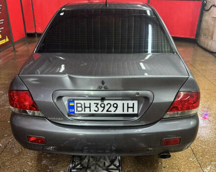 Серый Мицубиси Лансер, объемом двигателя 1.6 л и пробегом 268 тыс. км за 4600 $, фото 5 на Automoto.ua